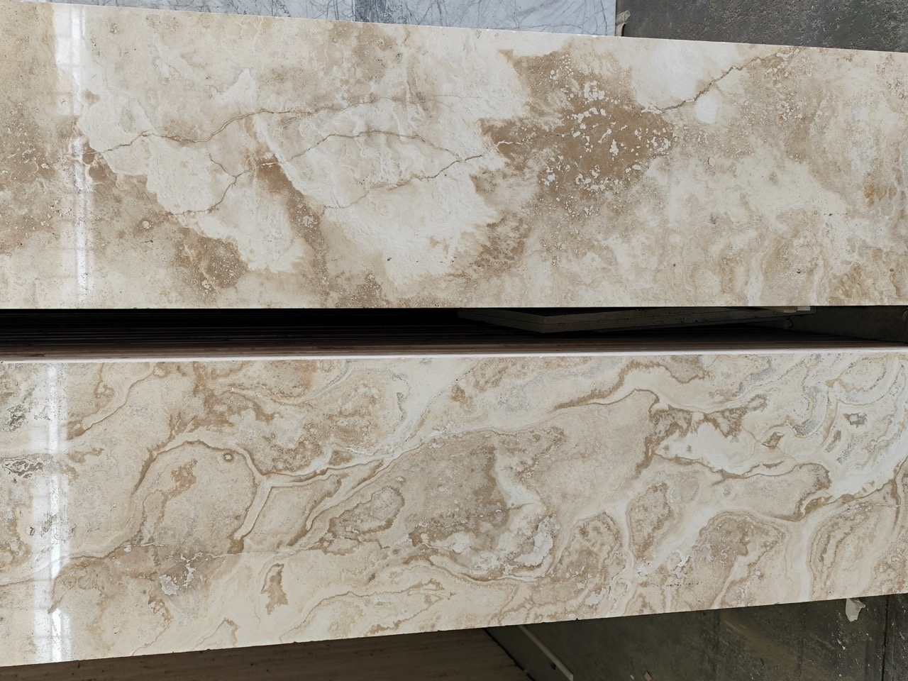 Travertine natural stone collection with warm tones and porous texture
